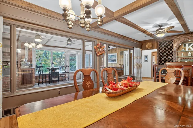 a bedroom with furniture and large windows