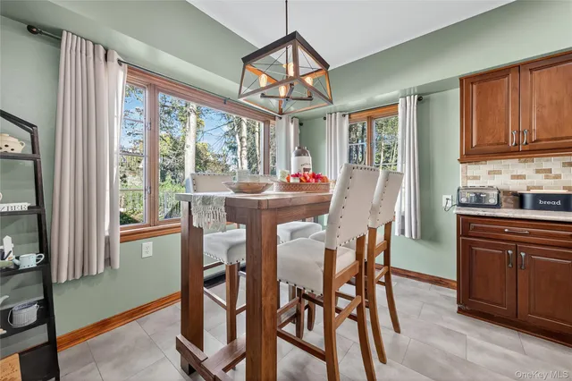 a dining room with furniture window wooden floor
