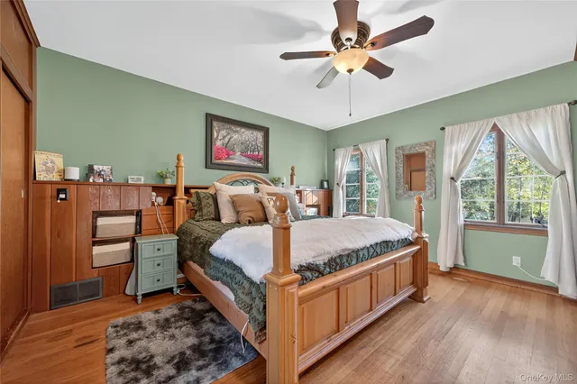 a bed room with a bed and a chandelier