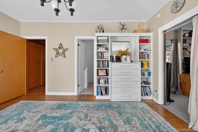 a bedroom with bed and a window