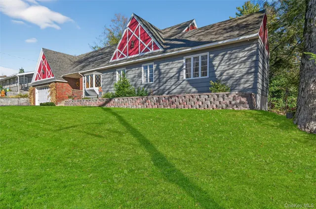 a front view of house with yard and entertaining space