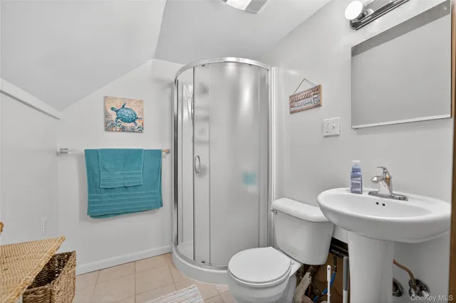 a bedroom with a large bed and a couch