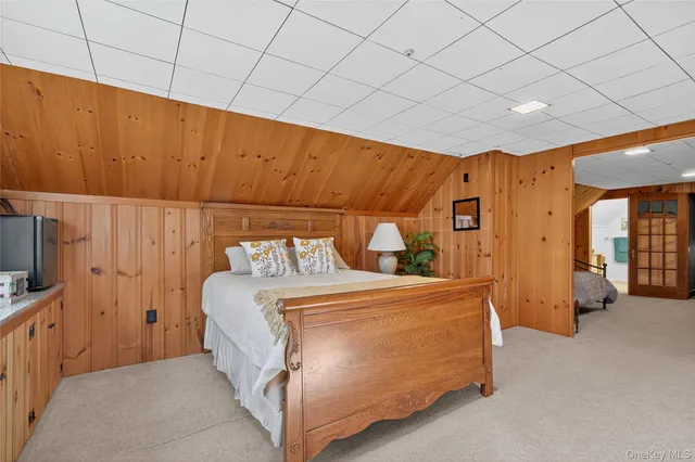 a bedroom with a bed and a couch