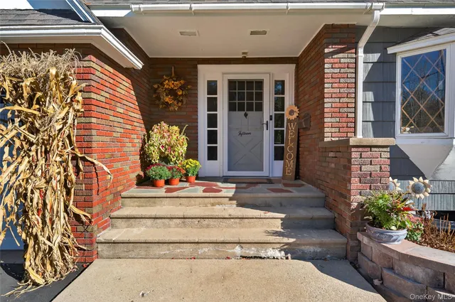 a view of a house with potted plants