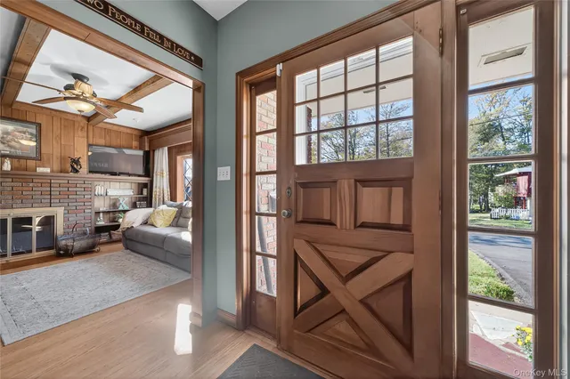 a view of living room with furniture and a floor to ceiling window