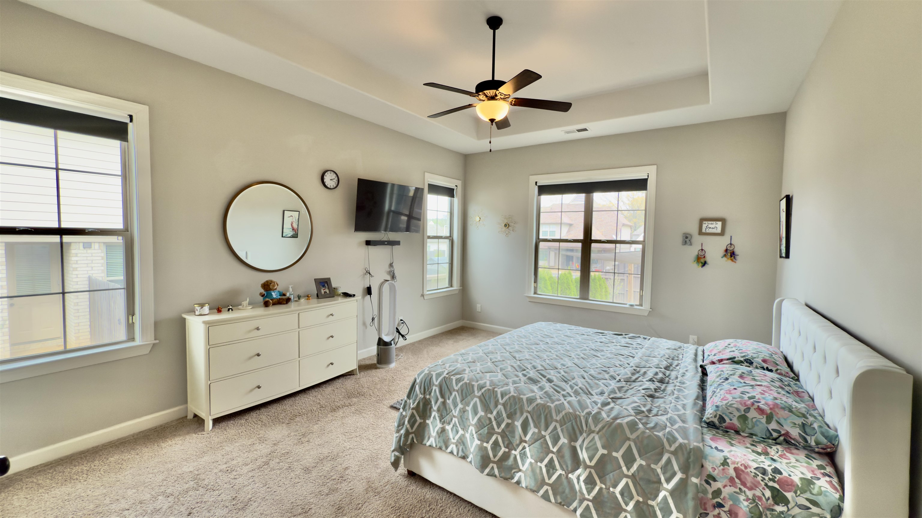 1280 Mountain Side Drive Collierville, TN 38017 - Photo 10 of 29 Bedroom featuring a raised ceiling, light carpet, baseboards, visible vents, and ceiling fan