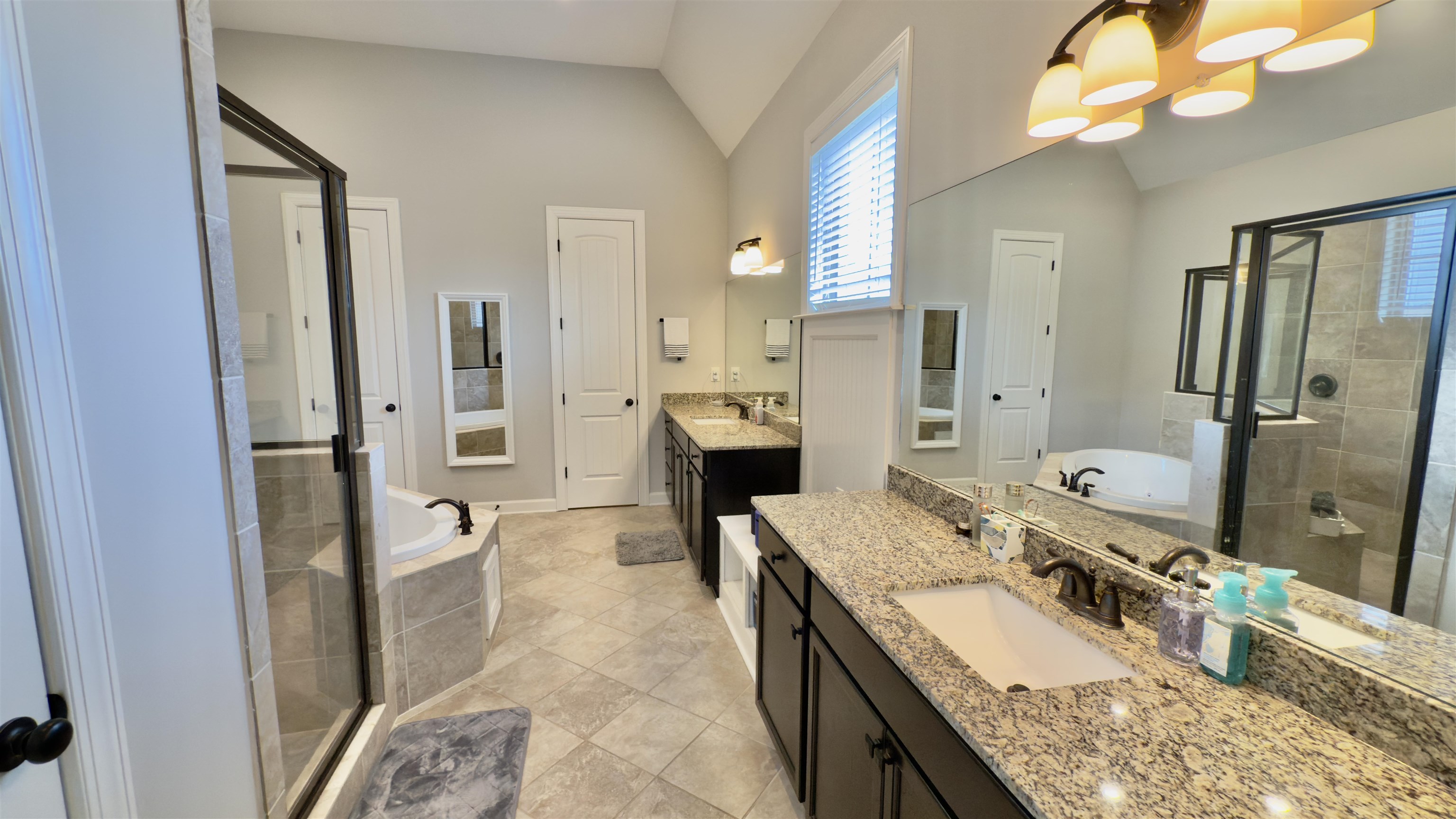 1280 Mountain Side Drive Collierville, TN 38017 - Photo 11 of 29 Bathroom featuring a shower stall, lofted ceiling, and a sink