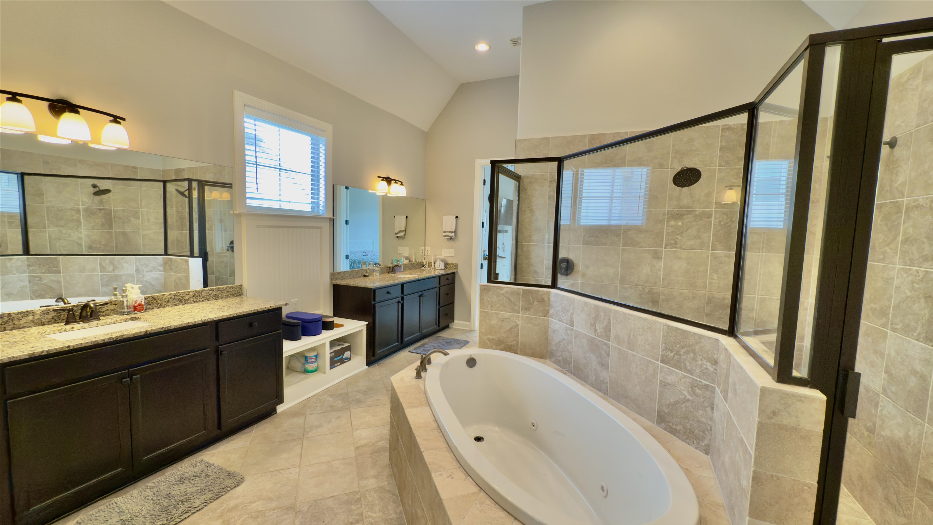 1280 Mountain Side Drive Collierville, TN 38017 - Photo 12 of 29 Full bathroom with a shower stall, a tub with jets, two vanities, lofted ceiling, and a sink