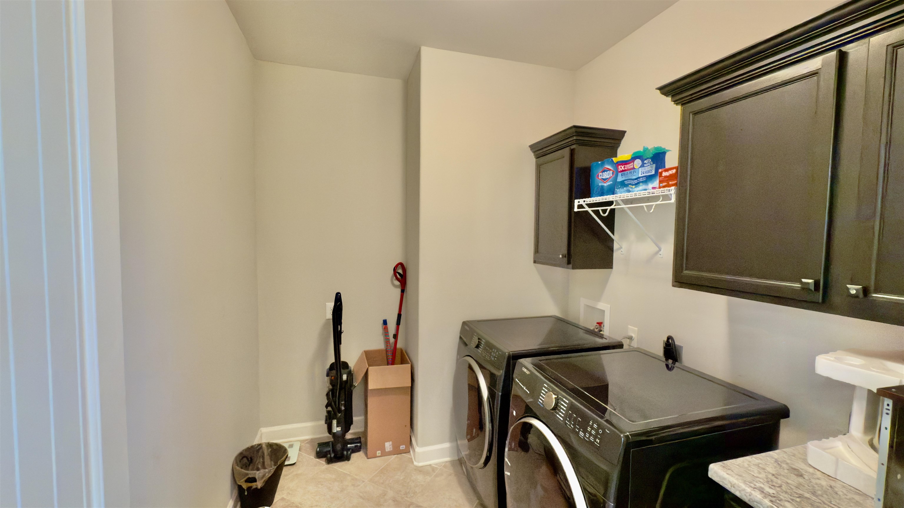 1280 Mountain Side Drive Collierville, TN 38017 - Photo 13 of 29 Clothes washing area featuring baseboards, washer and dryer, cabinet space, and light tile patterned floors