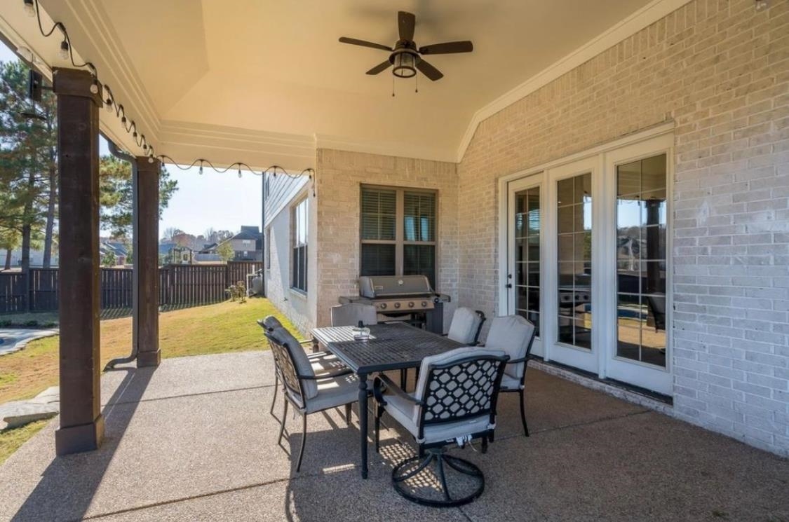 1280 Mountain Side Drive Collierville, TN 38017 - Photo 24 of 29 View of patio with a ceiling fan, area for grilling, fence, and outdoor dining space