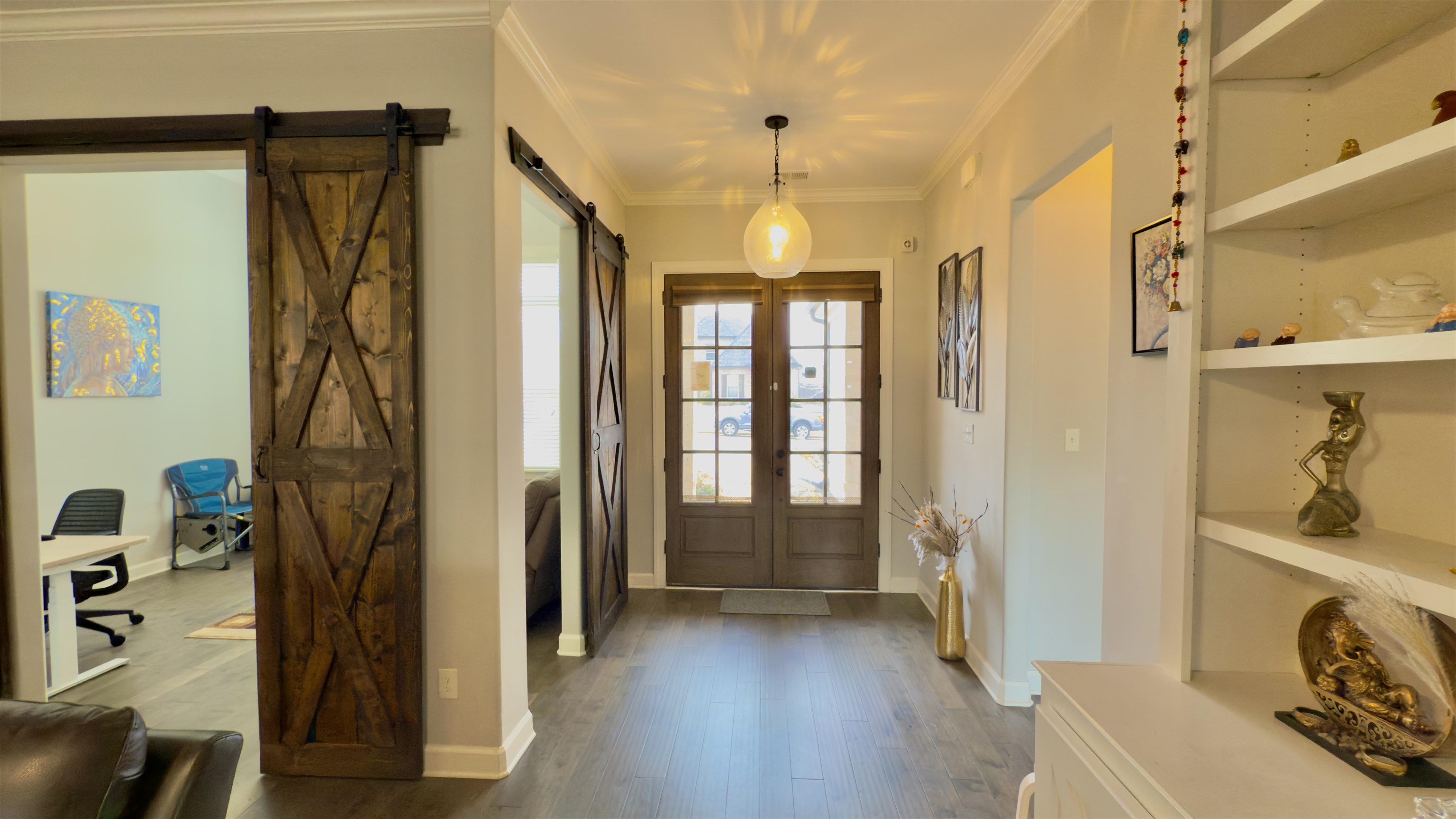 1280 Mountain Side Drive Collierville, TN 38017 - Photo 5 of 29 Entryway with dark wood-style floors, crown molding, a barn door, and baseboards