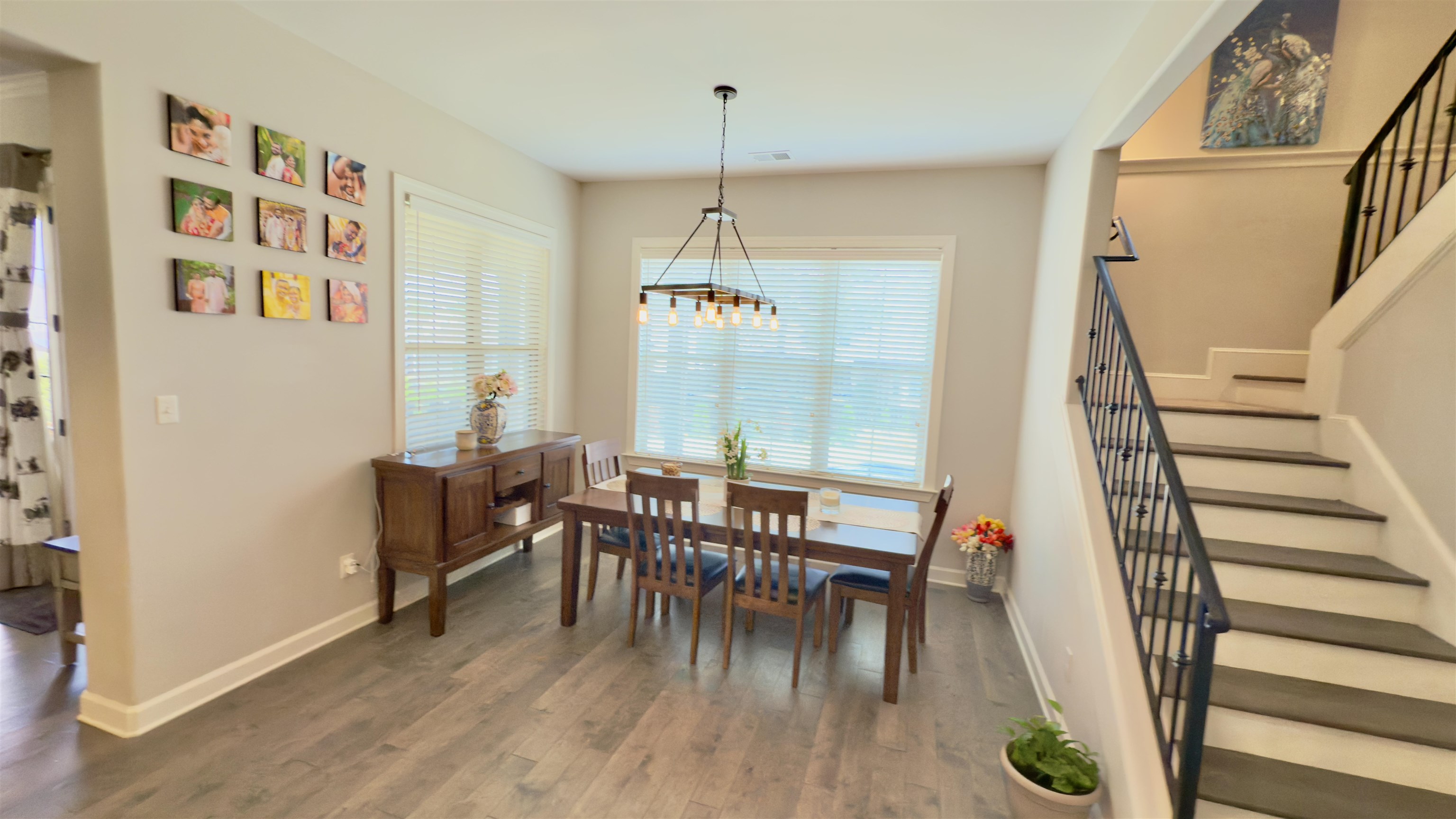 1280 Mountain Side Drive Collierville, TN 38017 - Photo 9 of 29 Dining space featuring an inviting chandelier, baseboards, stairs, and wood finished floors
