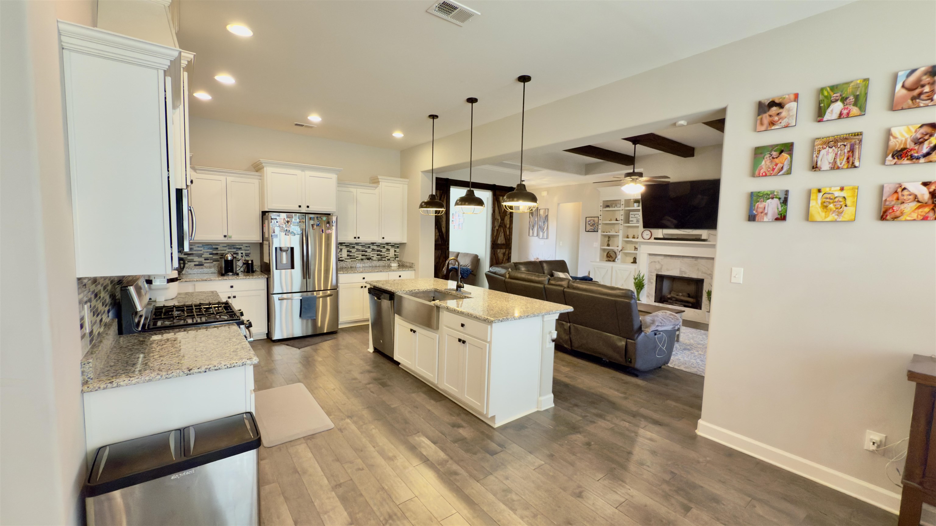 1280 Mountain Side Drive Collierville, TN 38017 - Photo 29 of 29 Kitchen with visible vents, stainless steel appliances, dark wood finished floors, a sink, and open floor plan