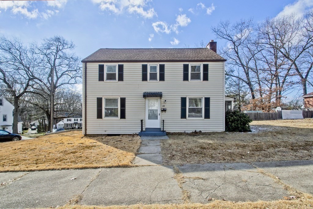 138 Appleton Street Springfield, MA 01108 - Photo 1 of 42 a view of a white house with a large tree in front of it