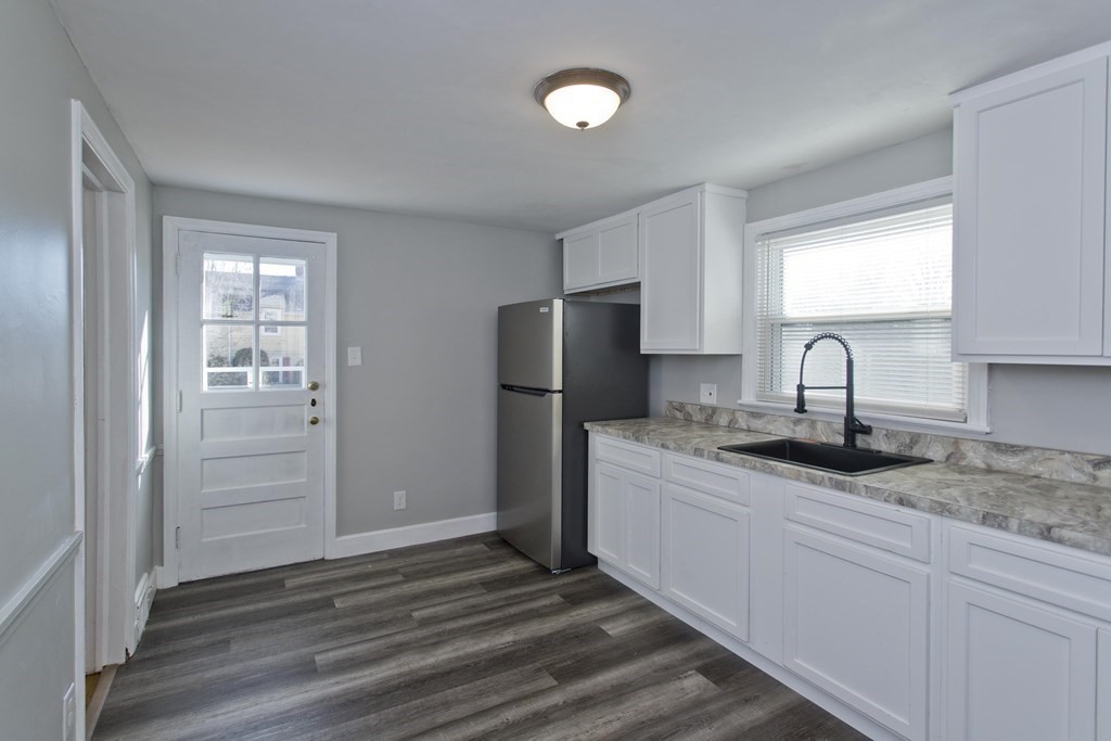 138 Appleton Street Springfield, MA 01108 - Photo 13 of 42 a kitchen with stainless steel appliances granite countertop a refrigerator and a sink