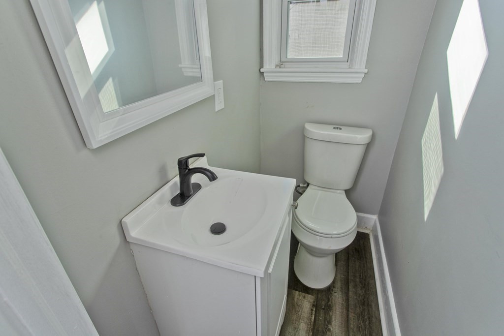 138 Appleton Street Springfield, MA 01108 - Photo 16 of 42 a white toilet sitting next to a white sink