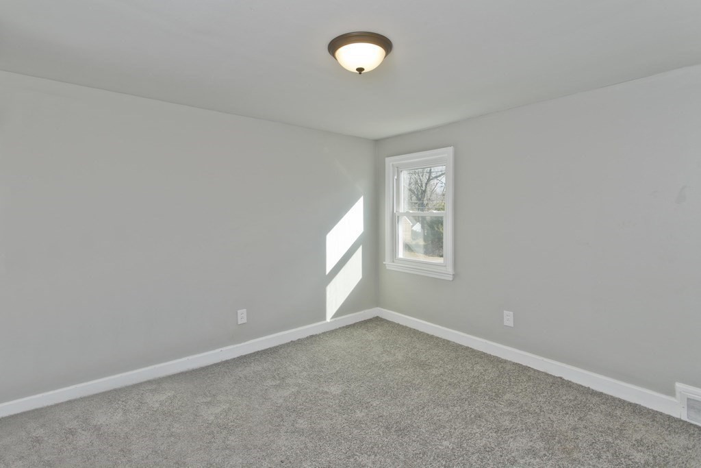 138 Appleton Street Springfield, MA 01108 - Photo 20 of 42 an empty room with a empty space and window