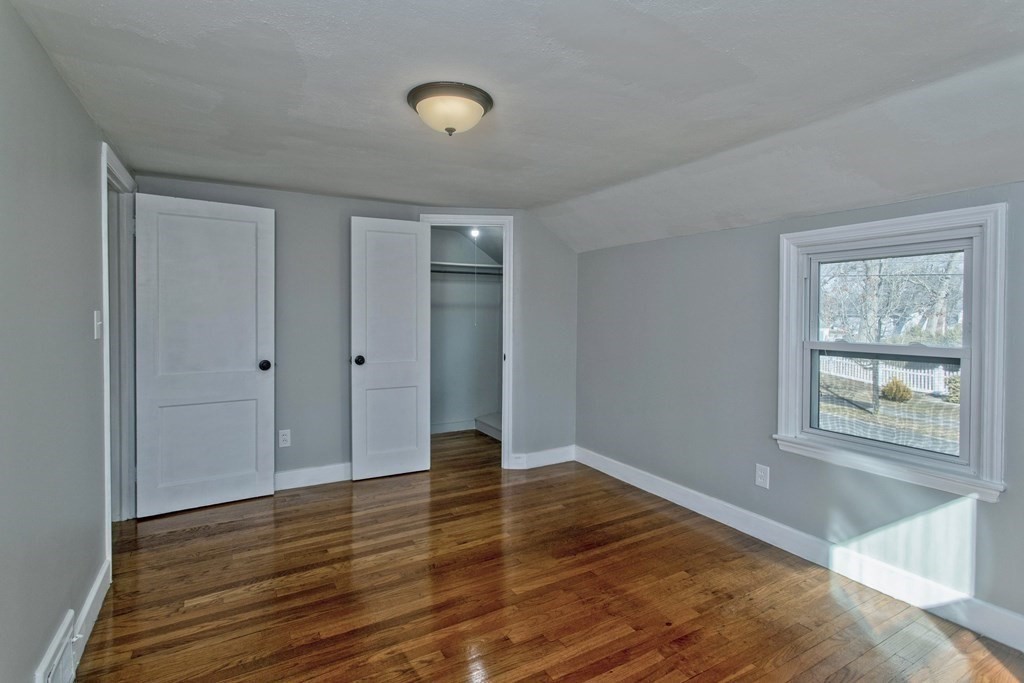 138 Appleton Street Springfield, MA 01108 - Photo 27 of 42 a view of an empty room with wooden floor and a window