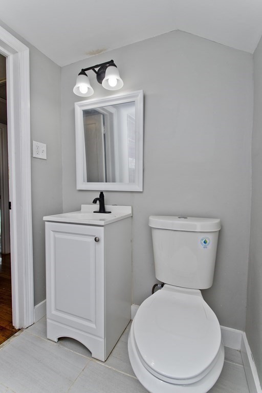 138 Appleton Street Springfield, MA 01108 - Photo 29 of 42 a white toilet sitting next to a bathroom sink