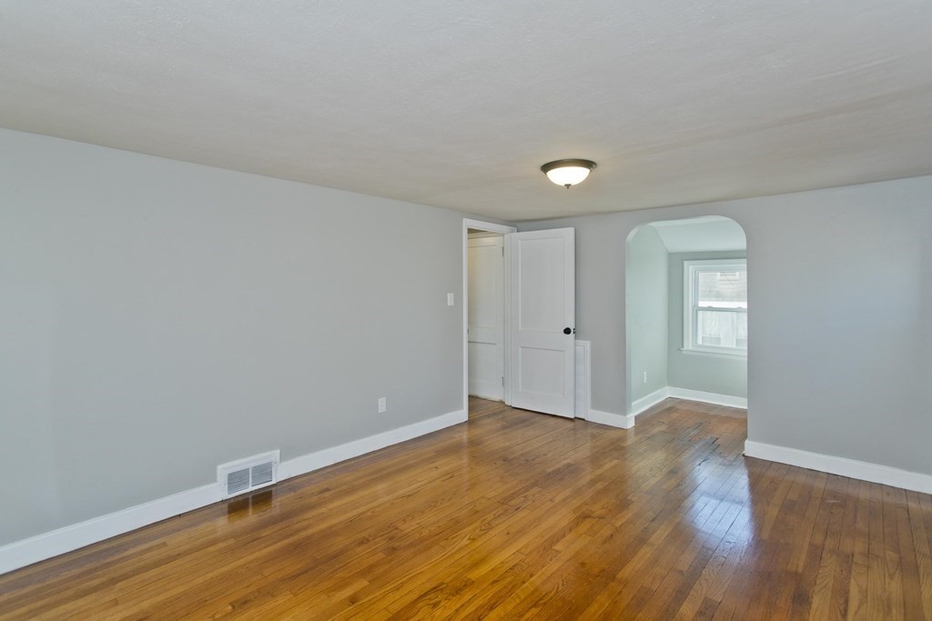 138 Appleton Street Springfield, MA 01108 - Photo 33 of 42 a view of an empty room with wooden floor