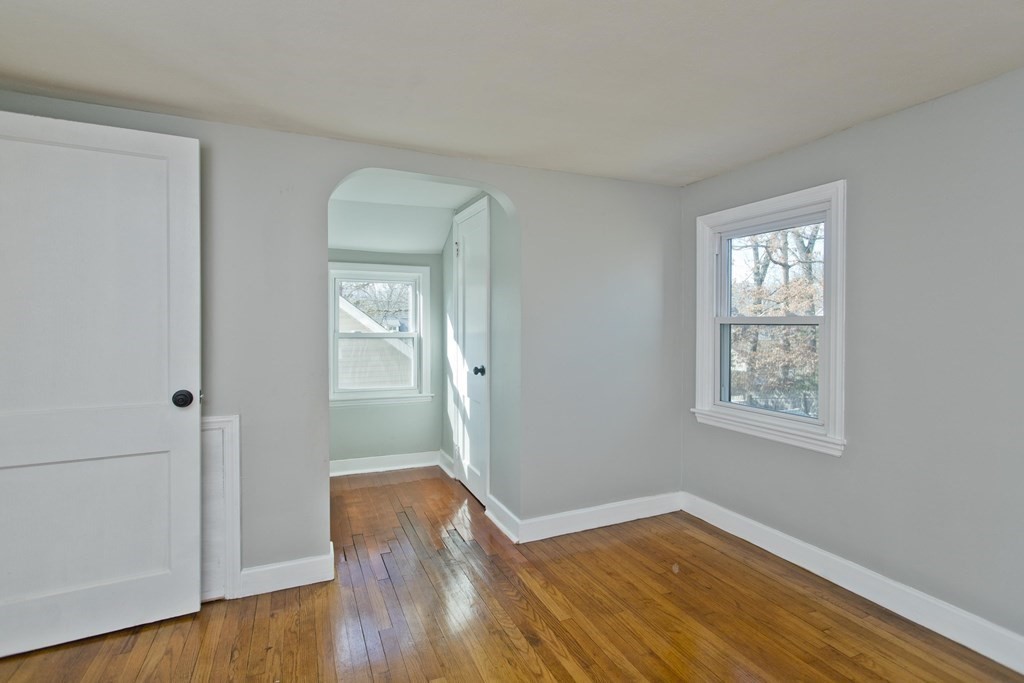 138 Appleton Street Springfield, MA 01108 - Photo 34 of 42 a view of an empty room with wooden floor and a window