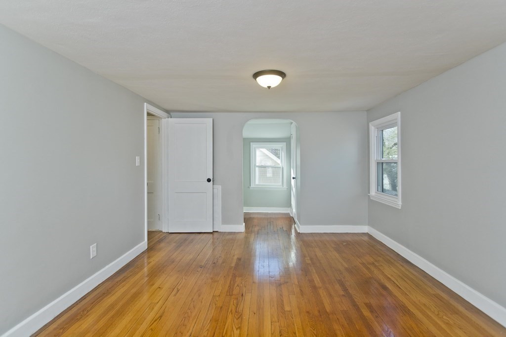 138 Appleton Street Springfield, MA 01108 - Photo 35 of 42 a view of a big room with wooden floor and windows