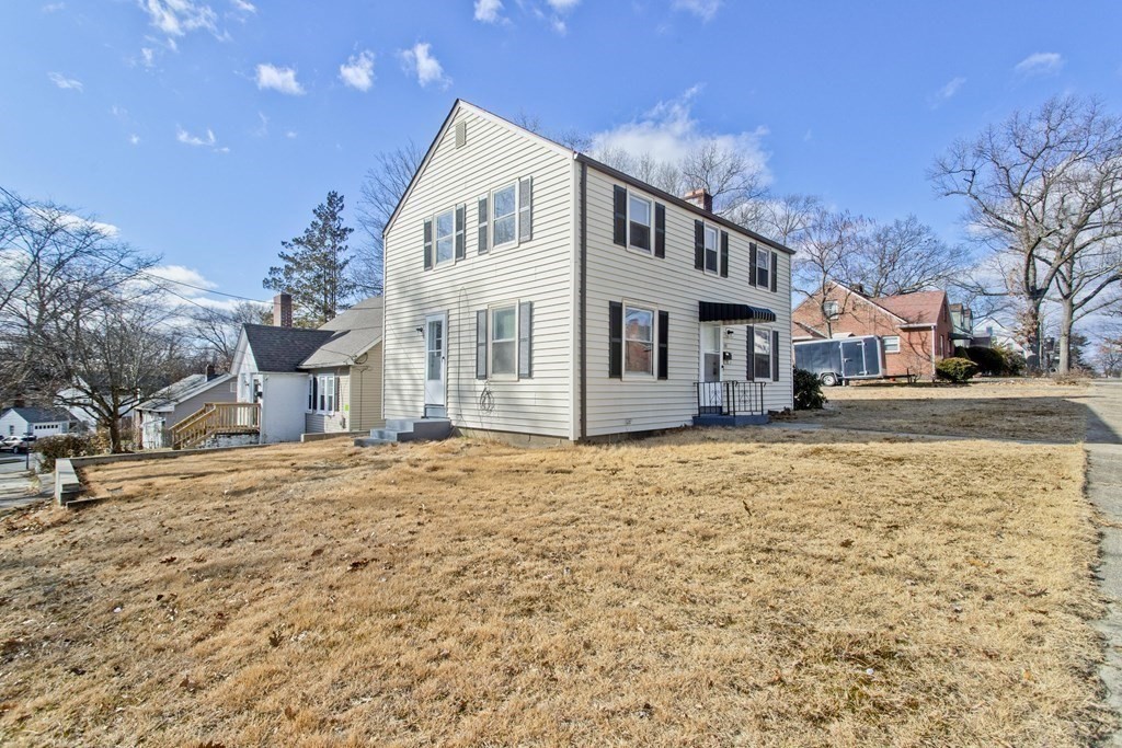 138 Appleton Street Springfield, MA 01108 - Photo 5 of 42 a front view of a house with a yard