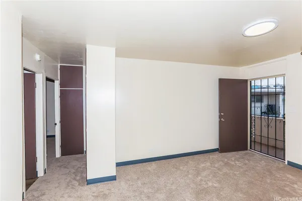 a view of an empty room with a window