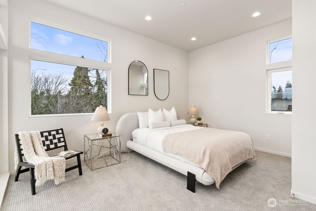 2925 Franklin Avenue East, Unit A Seattle, WA 98102 - Photo 13 of 32 a bedroom with a bed chair and window