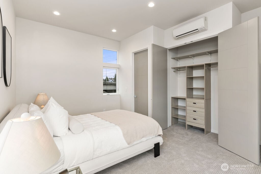 2925 Franklin Avenue East, Unit A Seattle, WA 98102 - Photo 15 of 32 a bedroom with a bed and a window