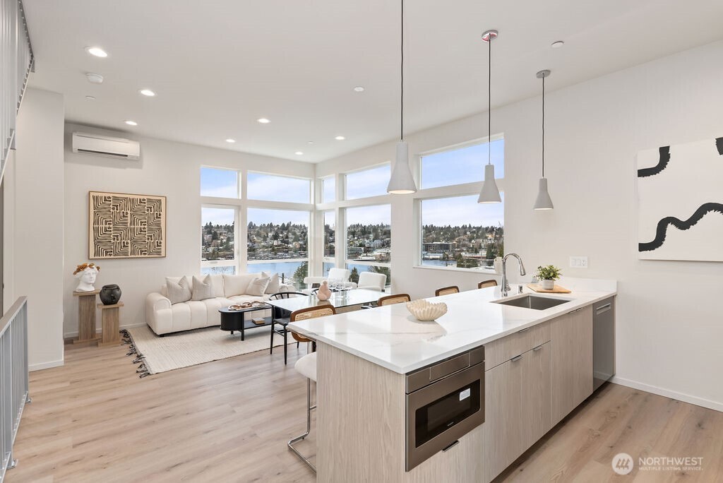 2925 Franklin Avenue East, Unit A Seattle, WA 98102 - Photo 4 of 32 a kitchen with a sink stove and wooden floor