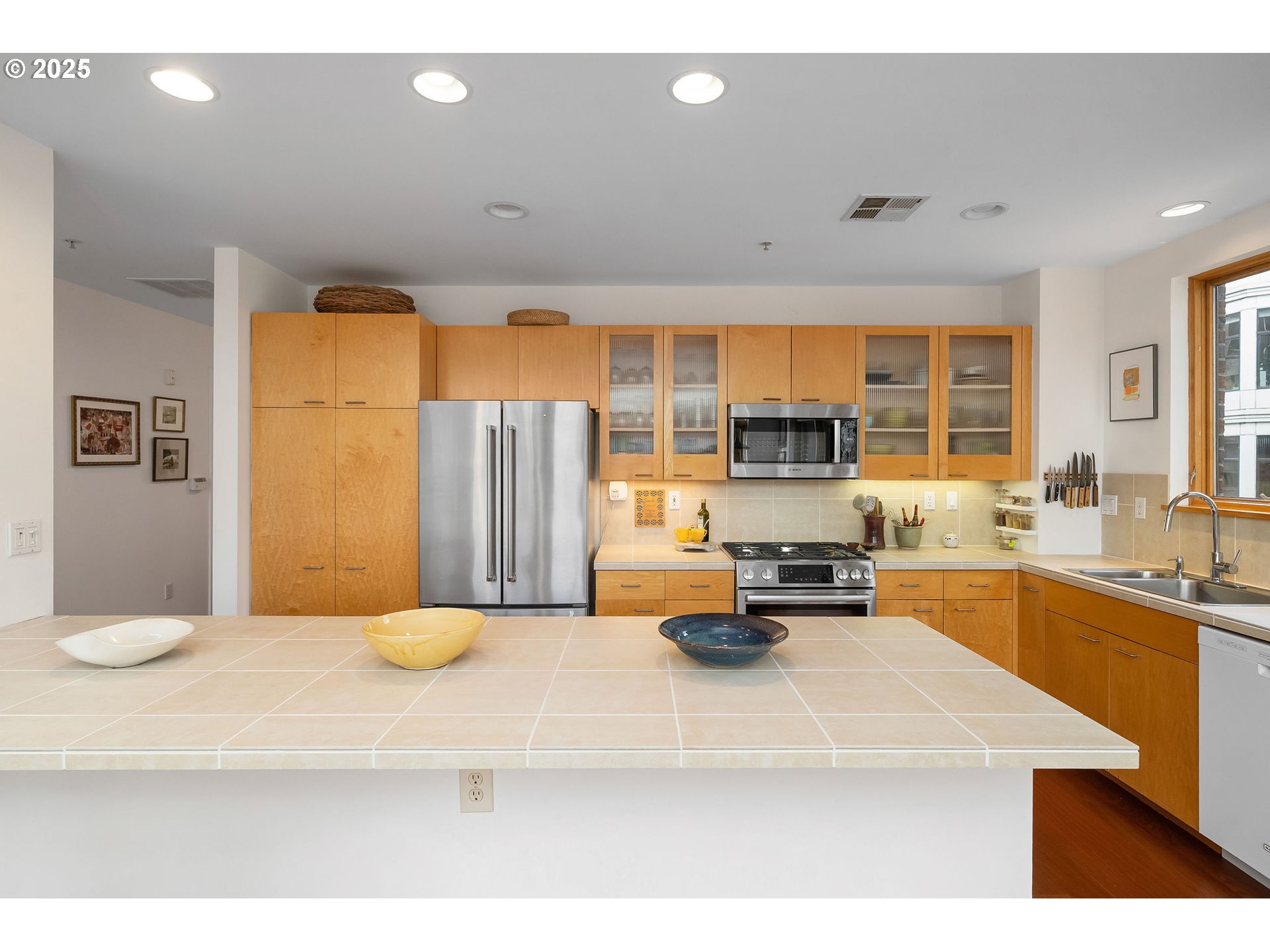 821 Northwest 11th Avenue, Unit 321 Portland, OR 97209 - Photo 22 of 48 a kitchen with a sink appliances and cabinets