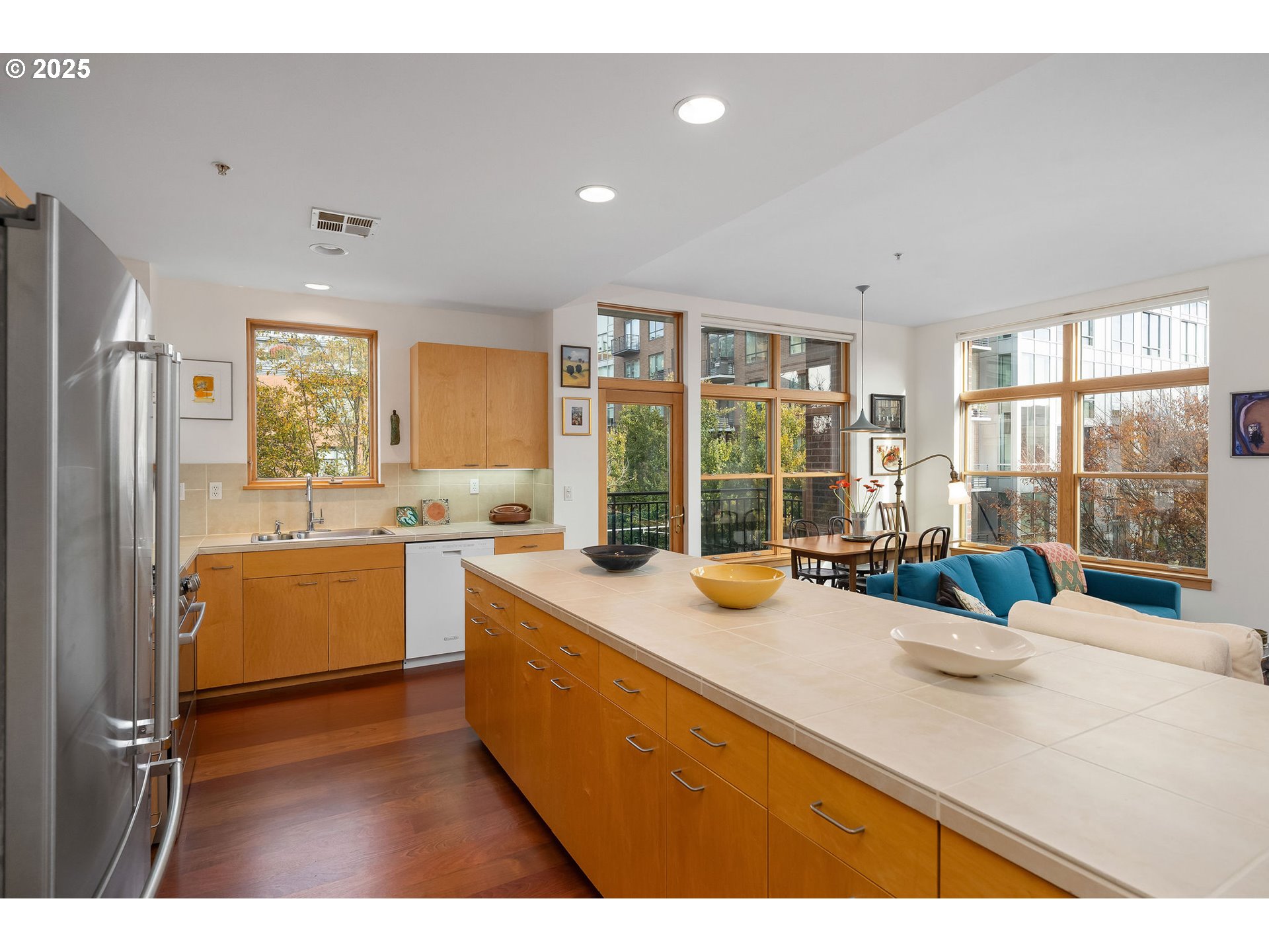 821 Northwest 11th Avenue, Unit 321 Portland, OR 97209 - Photo 23 of 48 a kitchen with sink and refrigerator
