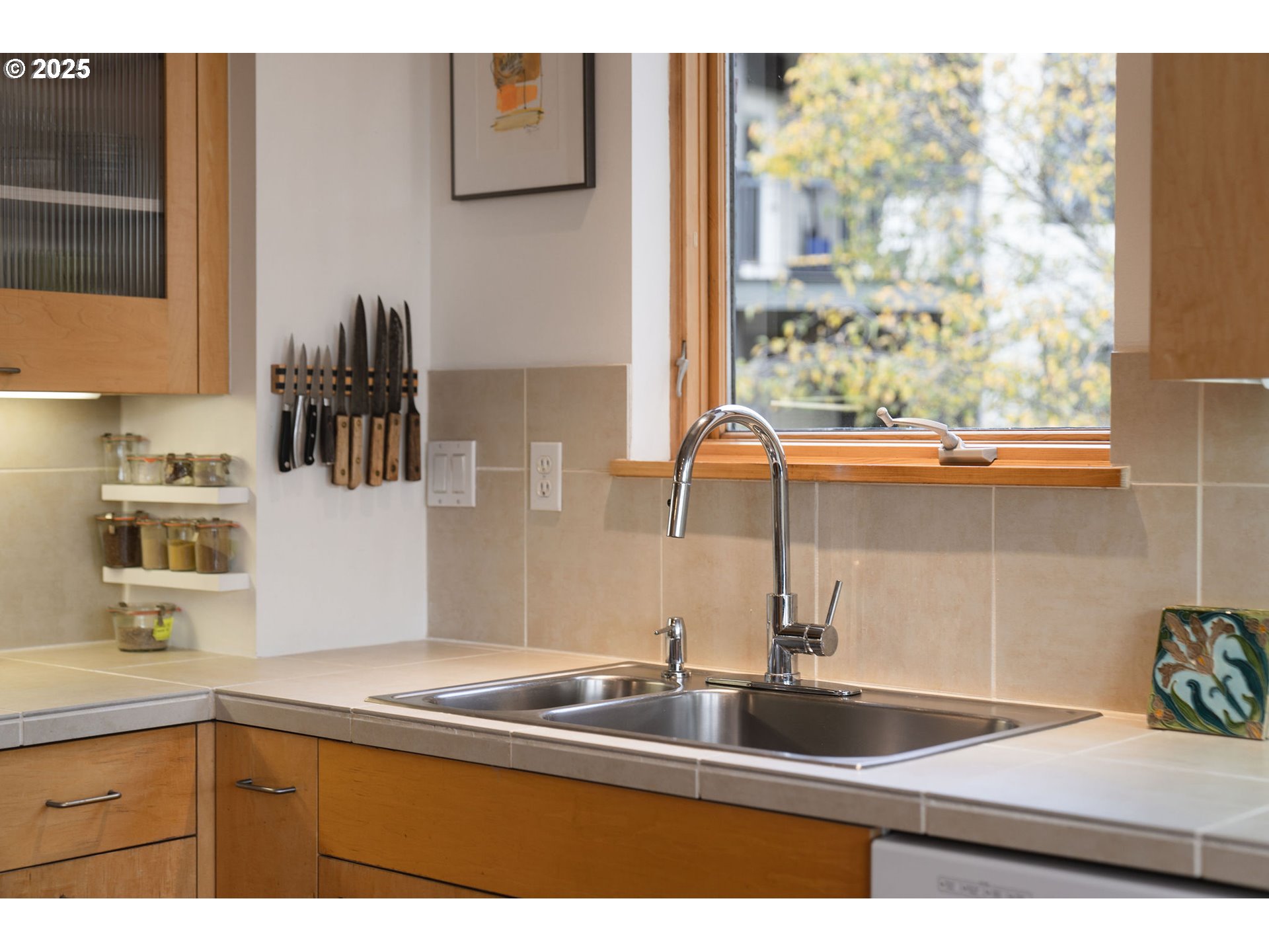 821 Northwest 11th Avenue, Unit 321 Portland, OR 97209 - Photo 24 of 48 a kitchen with a sink and a window
