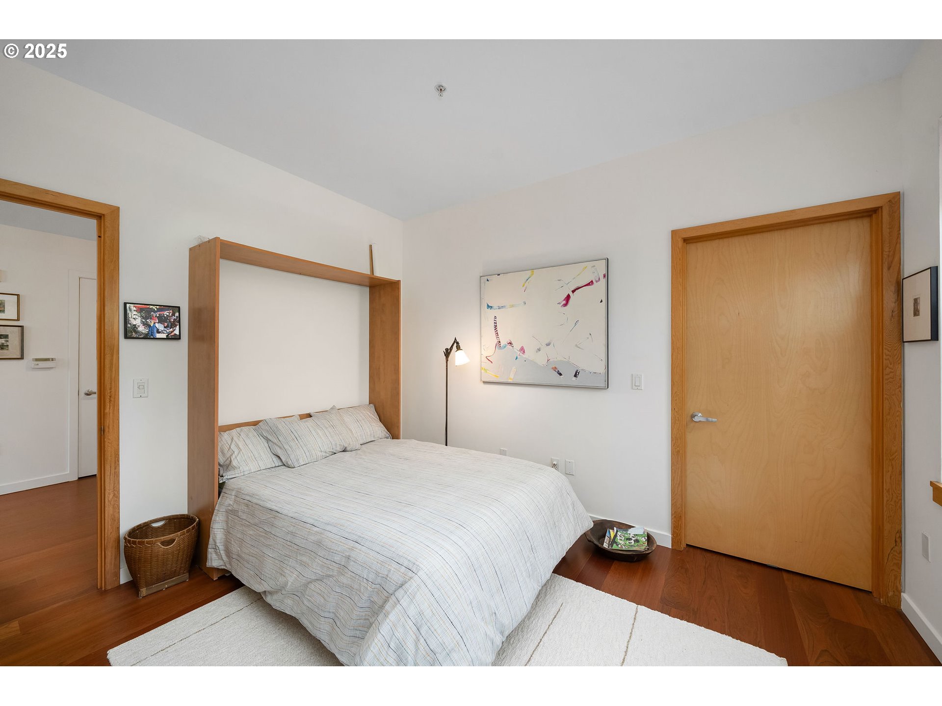 821 Northwest 11th Avenue, Unit 321 Portland, OR 97209 - Photo 33 of 48 a bedroom with a bed and a table