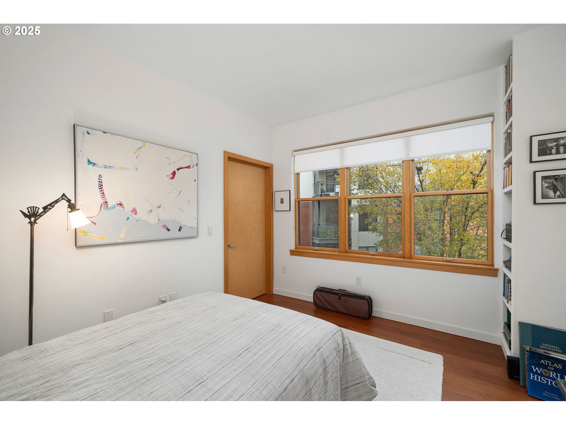 821 Northwest 11th Avenue, Unit 321 Portland, OR 97209 - Photo 34 of 48 a bedroom with a bed and a window with outer view