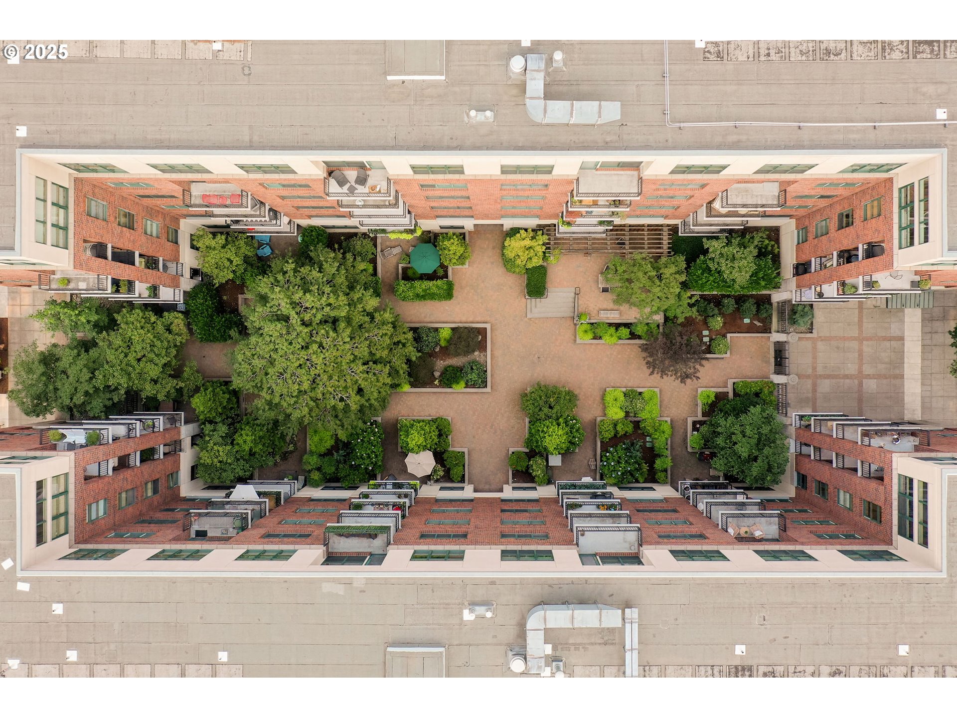 821 Northwest 11th Avenue, Unit 321 Portland, OR 97209 - Photo 38 of 48 a view of building with an outdoor space and seating area