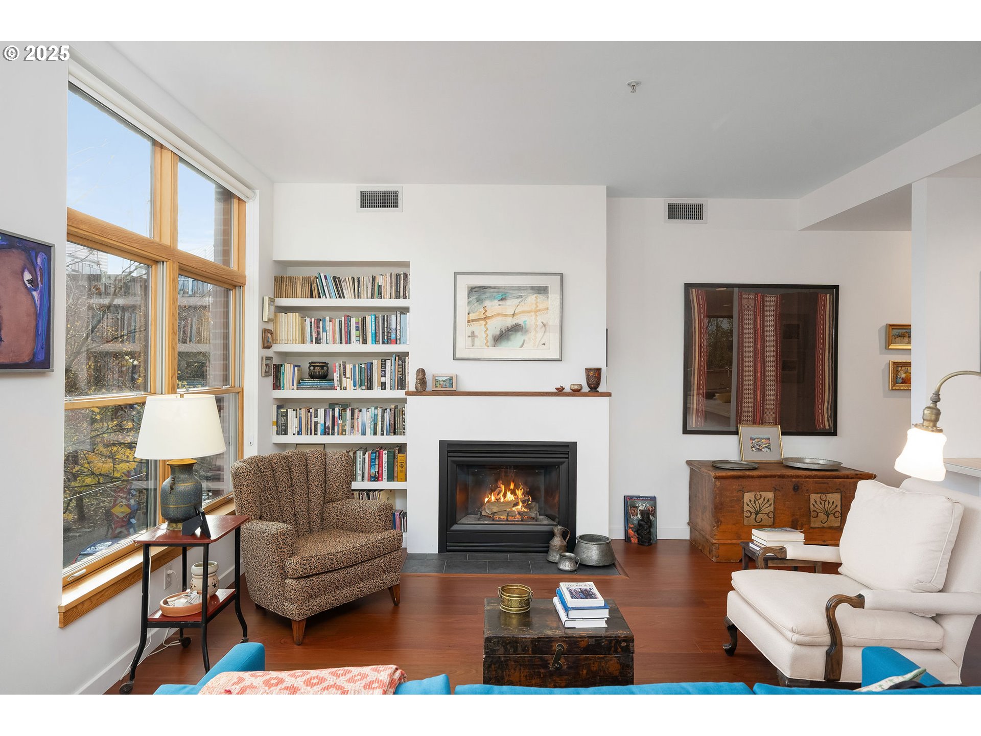 821 Northwest 11th Avenue, Unit 321 Portland, OR 97209 - Photo 10 of 48 a living room with furniture a rug and a fireplace