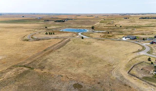 a view of a swimming pool with an outdoor seating