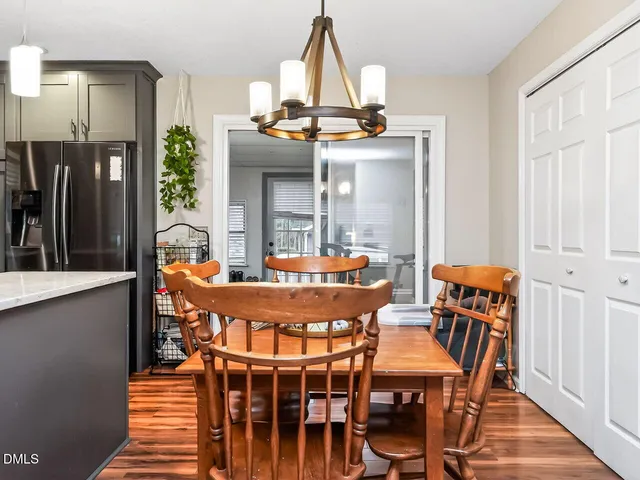 a view of a dining room with furniture and window