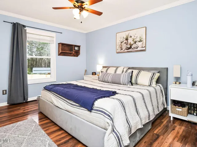 a bedroom with bed and window