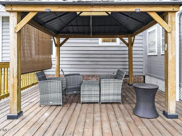 a view of deck with wooden floor and outdoor seating