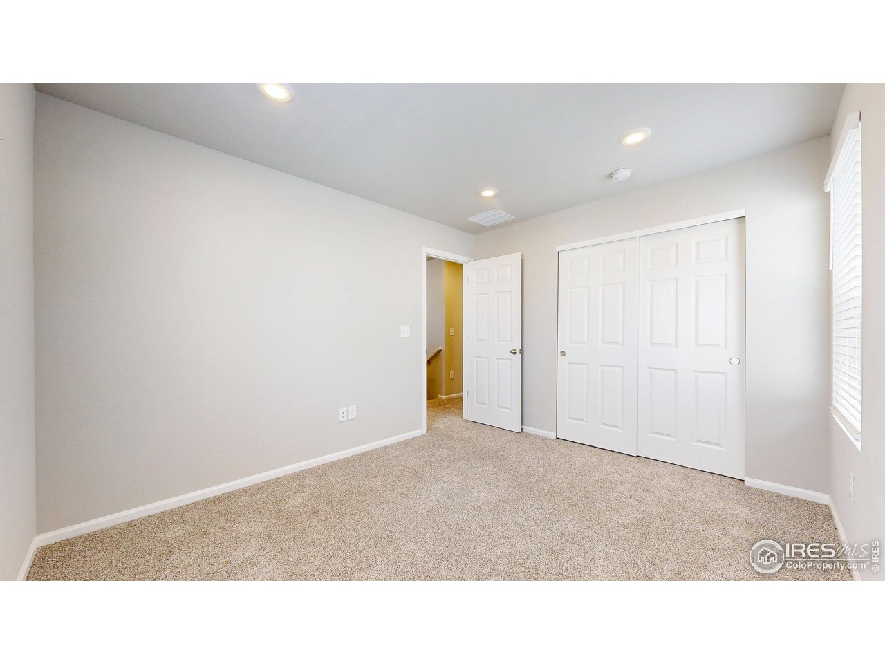 229 East 4th Street Berthoud, CO 80513 - Photo 21 of 49 a open hall with a ceiling fan