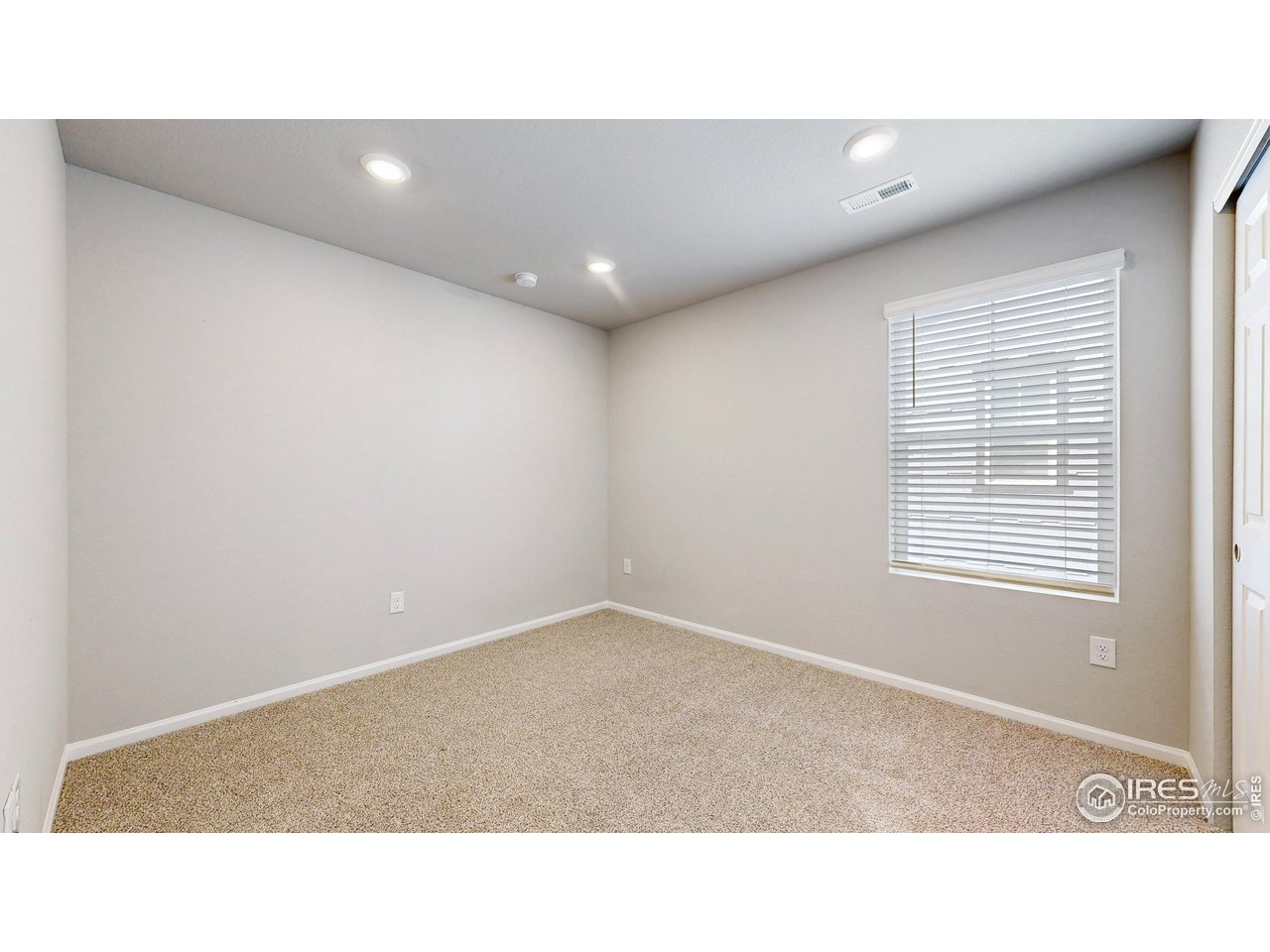 229 East 4th Street Berthoud, CO 80513 - Photo 22 of 49 a open hall with a window