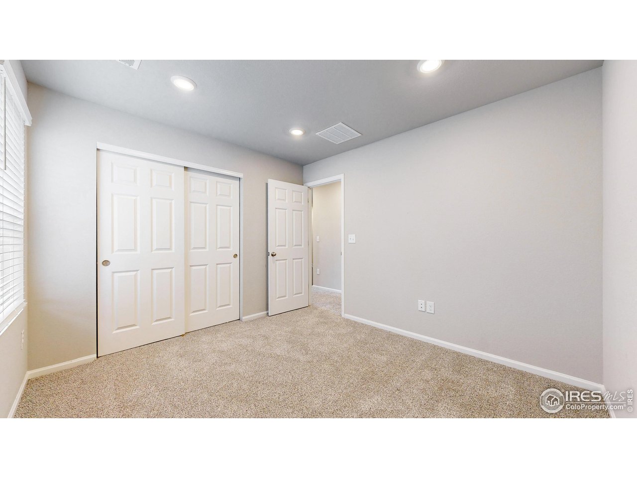 229 East 4th Street Berthoud, CO 80513 - Photo 23 of 49 a open hall with a bench