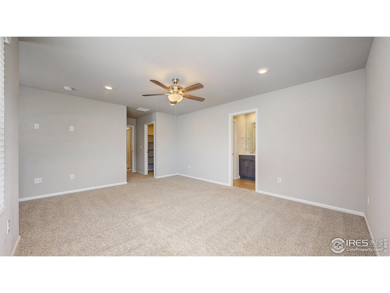 229 East 4th Street Berthoud, CO 80513 - Photo 27 of 49 a open hall with a ceiling fan