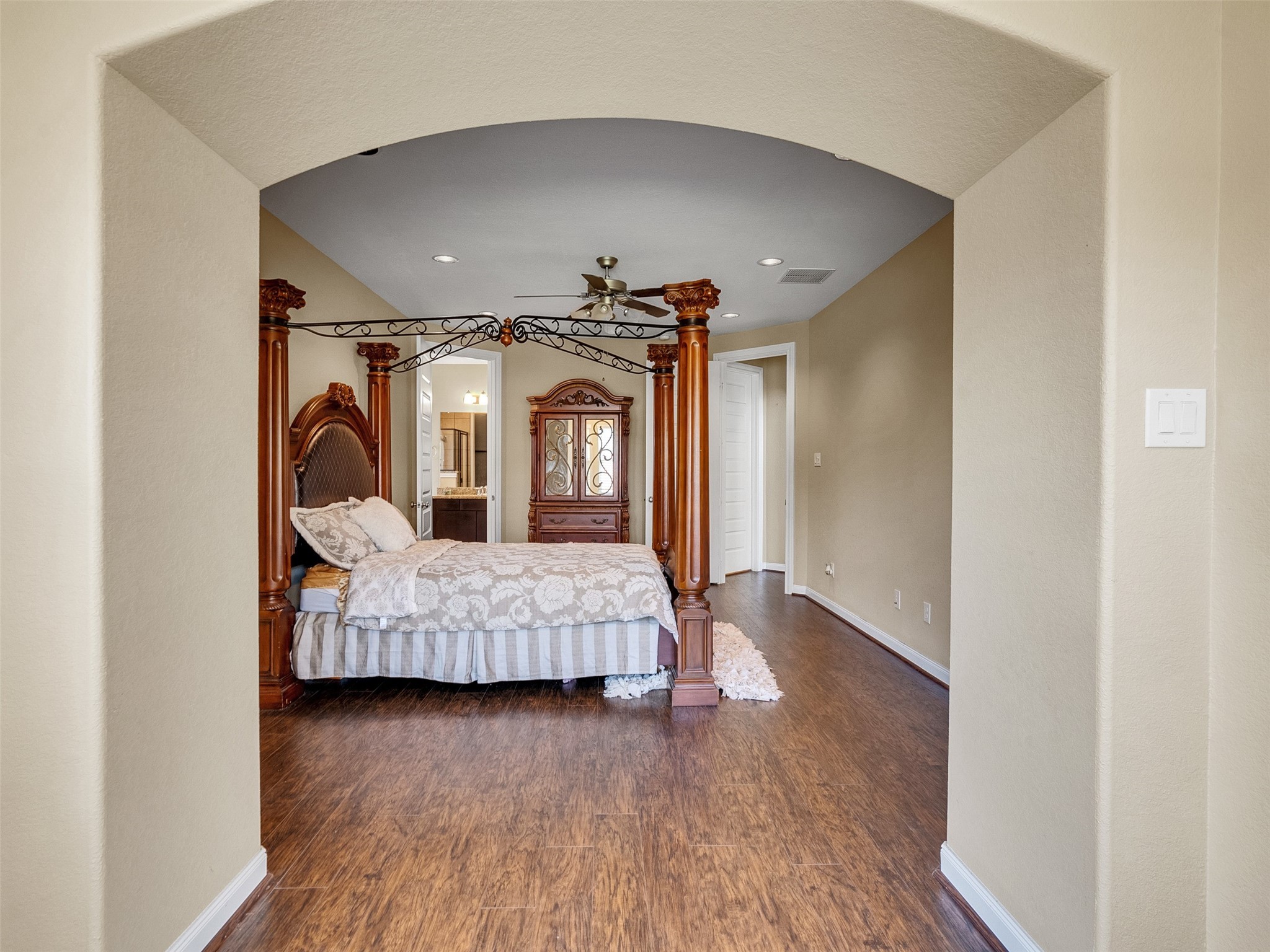 10135 Cypress Path Missouri City, TX 77459 - Photo 24 of 40 a living room with furniture and a wooden floor