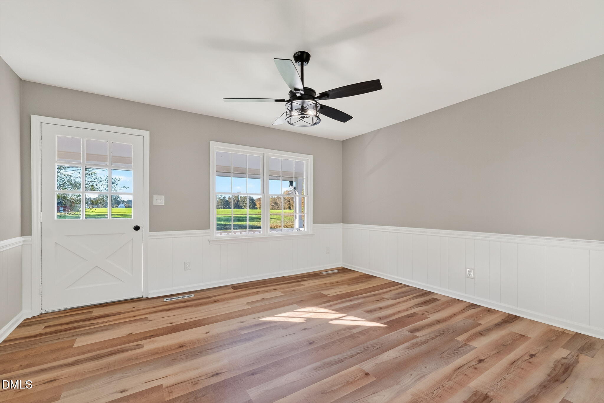 505 Pineview Road Kenly, NC 27542 - Photo 11 of 35 a view of empty room with wooden floor and fan