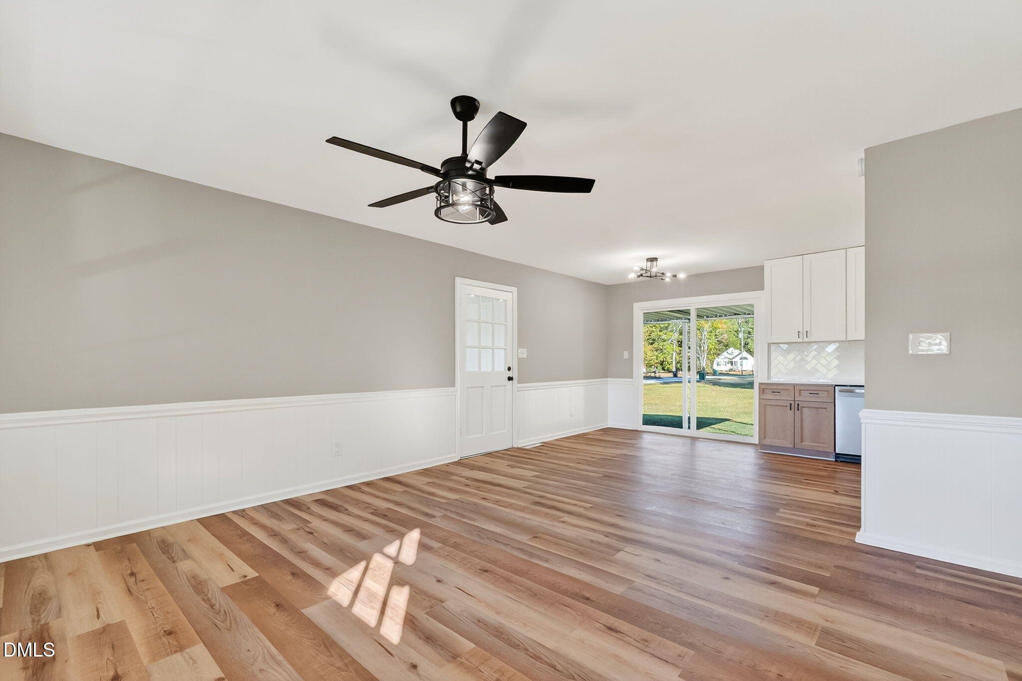 505 Pineview Road Kenly, NC 27542 - Photo 12 of 35 a view of a livingroom with a ceiling fan and wooden floor
