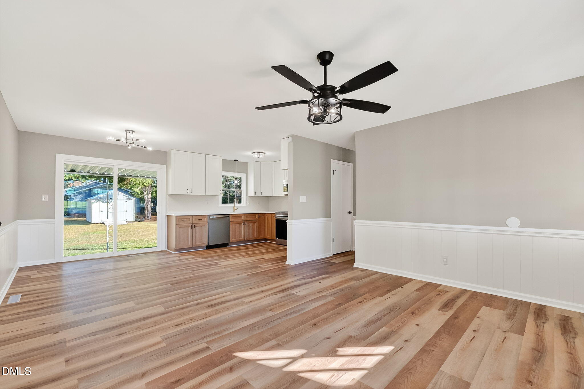 505 Pineview Road Kenly, NC 27542 - Photo 13 of 35 a view of a livingroom with a ceiling fan and wooden floor